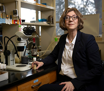 Sarah Certel, UM associated professor of neuroscience, poses for a photo in her lab