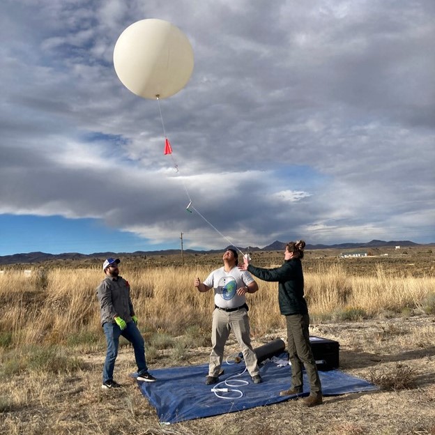 A Montana Space Grant team from Salish Kootenai College launches a radiosonde with a balloon during the October 2023 annular eclipse.