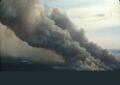large clouds of smoke from a forest fire