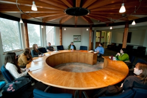 group of people sitting around a conference table