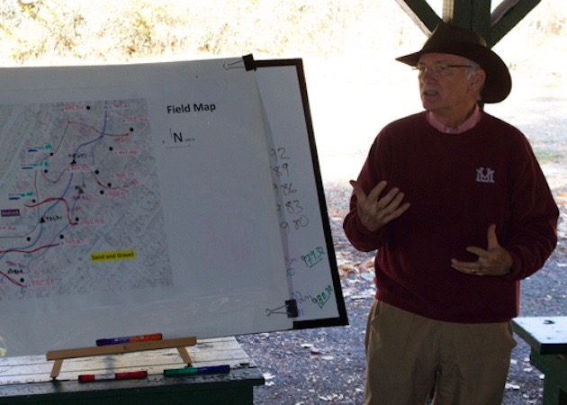 Photo of Bill Woessner discussing data. 