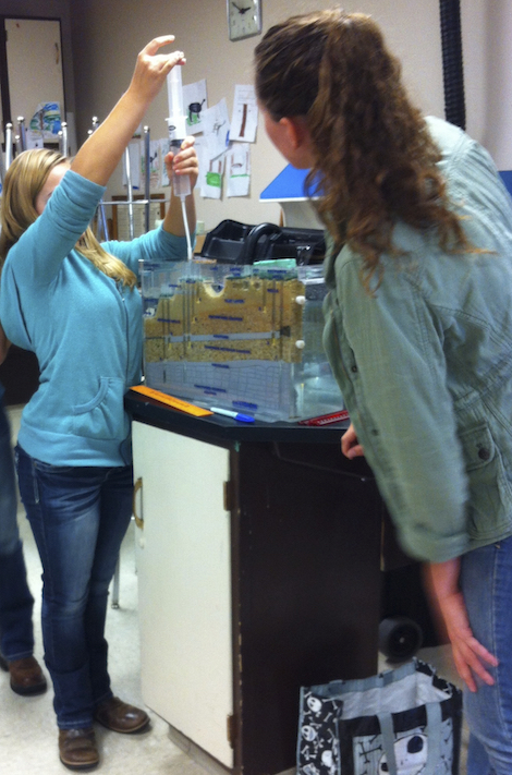 Photo of students using a groundwater model.